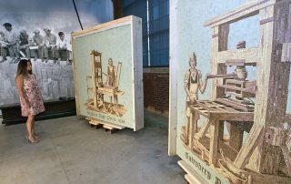 Woman looking at Bethlehem Steel mosaics